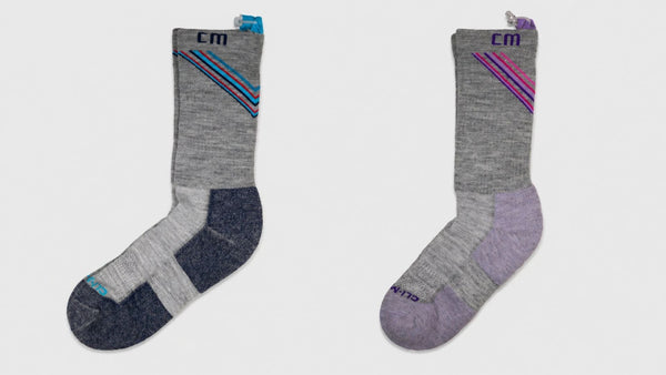 American-made sustainable gray athletic socks with reinforced heel and toe and subtle stripe detail on a clean background.