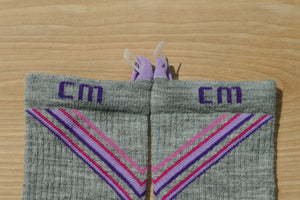 Step 3: E-Zmate clip open and inserting through the sock linking loops on Climatesox.com Women's Merino Wool Hiking Socks