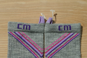 Step 2: E-Zmate clip being opened before threading through the linking loops on Climatesox.com Women's Merino Wool Crew Socks
