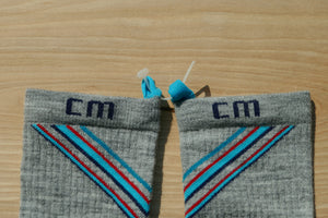 Step 3: Climatesox.com clip open and inserting through the linking loops on both E-Zmate Men's Linkable Merino Wool Crew Socks.